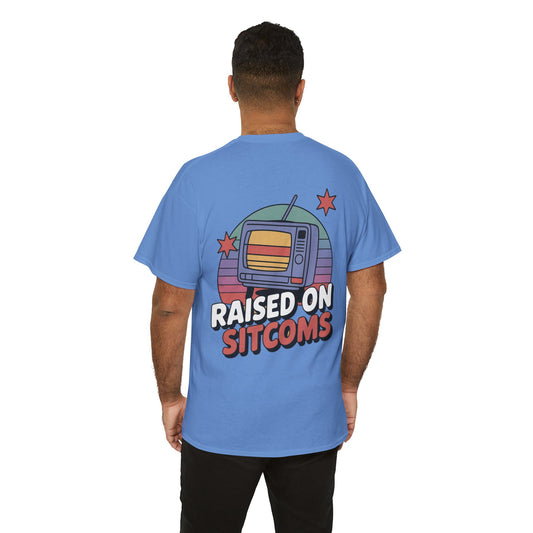 Person wearing a blue t-shirt with 'Raised on Sitcoms' design on the back