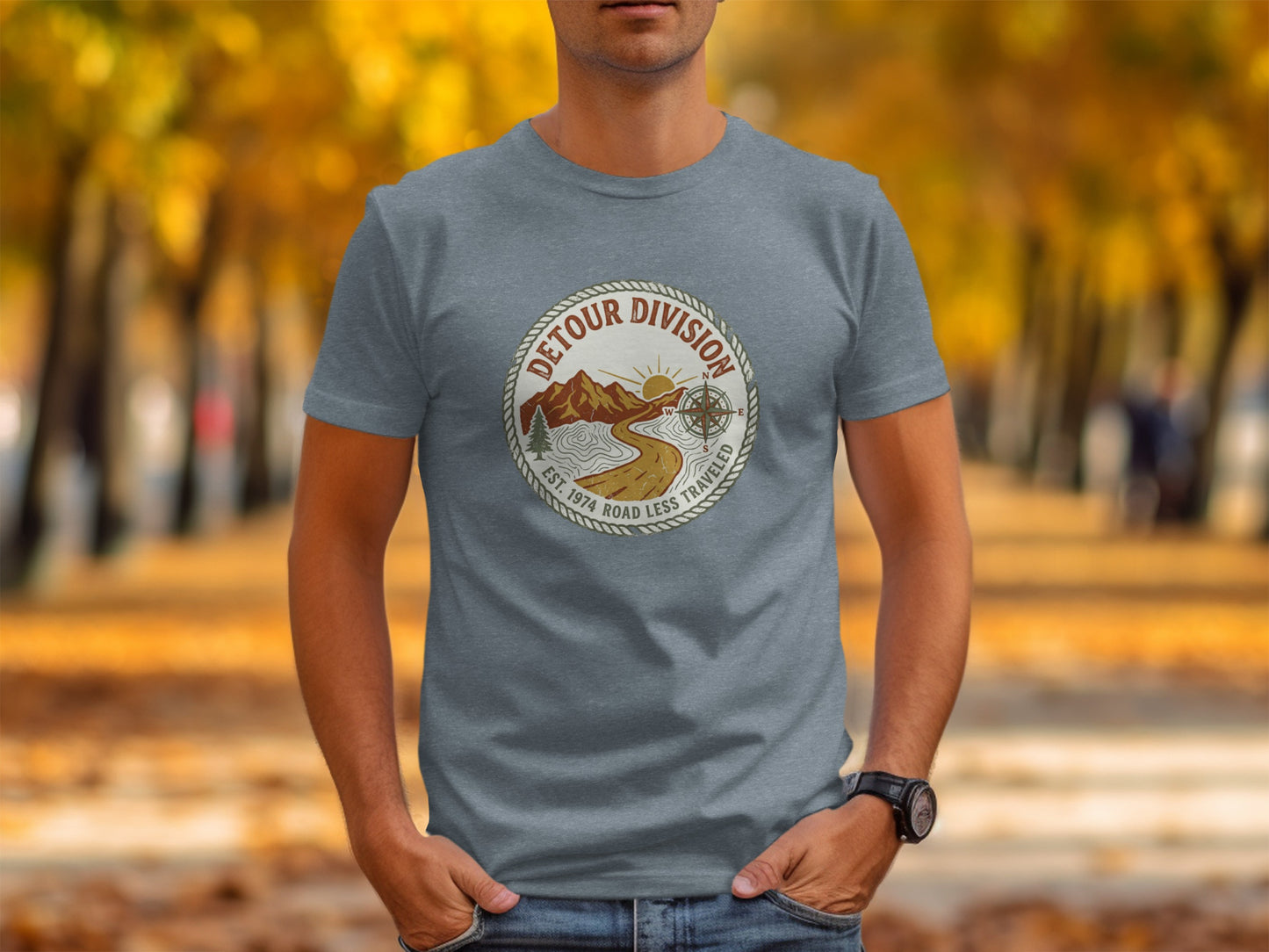 Detour Division Heritage | Vintage Outdoor Apparel: Gray t-shirt with circular "Detour Division" logo featuring mountains and compass.