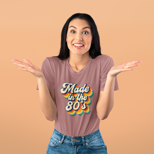 Woman wearing a t-shirt with 'Made in the 80s' design on a beige background