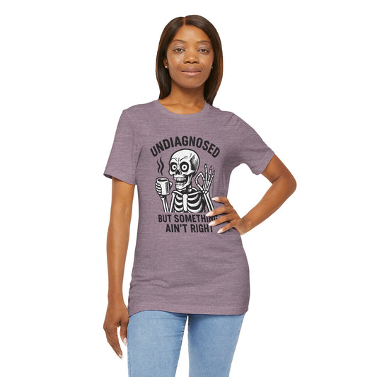 Woman wearing a purple t-shirt with a skeleton graphic and text on a white background