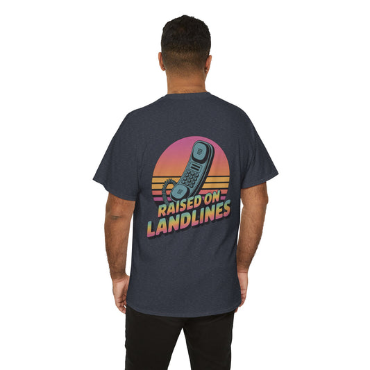 Person wearing a t-shirt with a retro phone design and 'Raised on Landlines' text on the back.