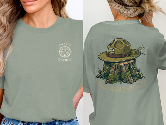 T-shirt with "Take the Detour" compass logo on front and park ranger hat graphic on back.