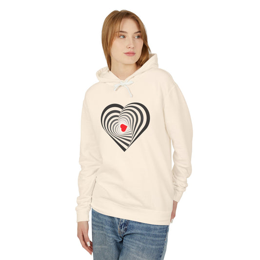 Woman wearing a cream hoodie with a heart design on a white background