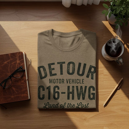 Brown t-shirt with "DETOUR MOTOR VEHICLE C16-HWG Land of the Lost" text.