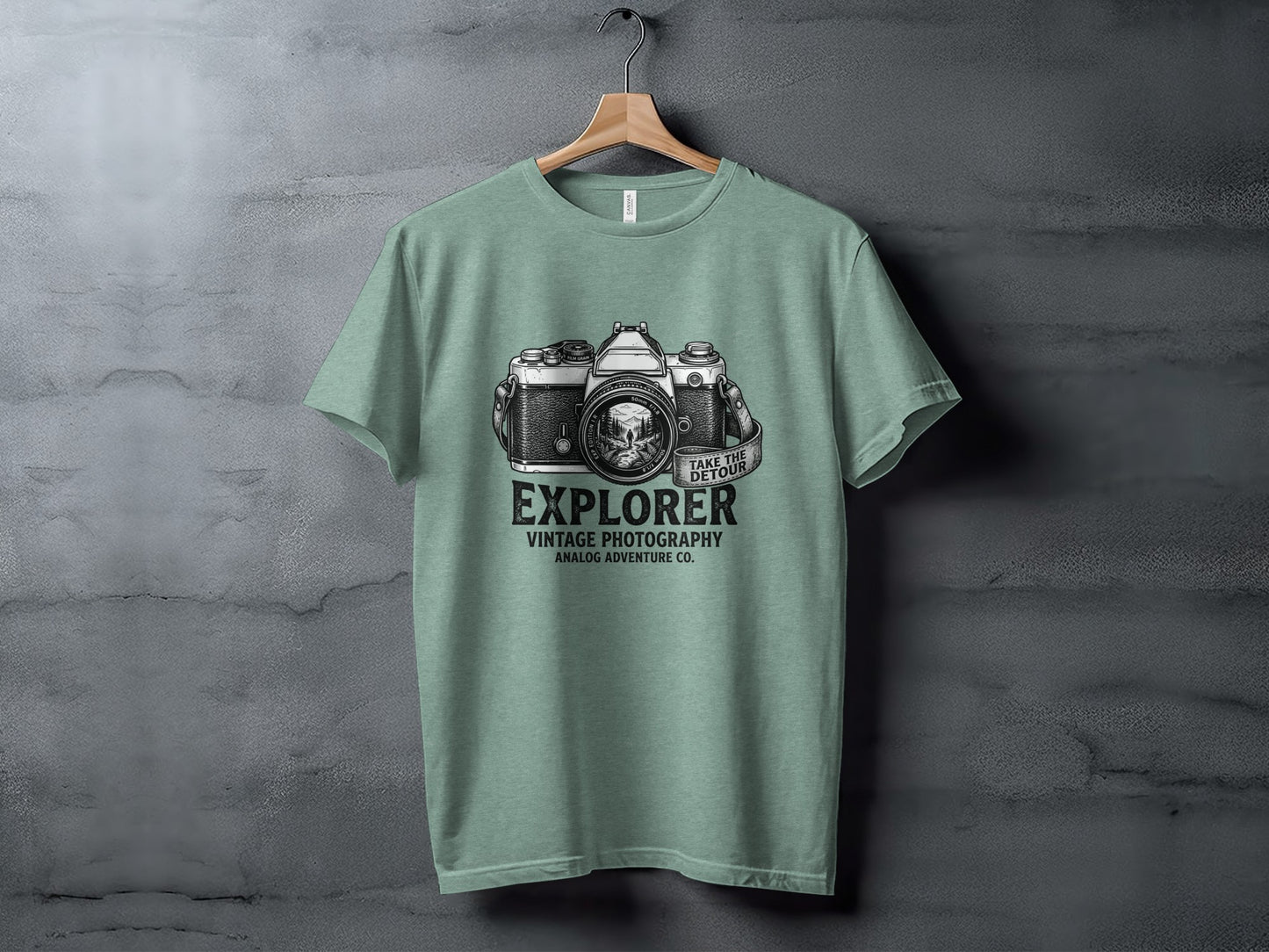 The Analog Explorer's Detour: Backcountry Outpost Shirt: Green t-shirt with vintage camera graphic and text "EXPLORER VINTAGE PHOTOGRAPHY ANALOG ADVENTURE CO."