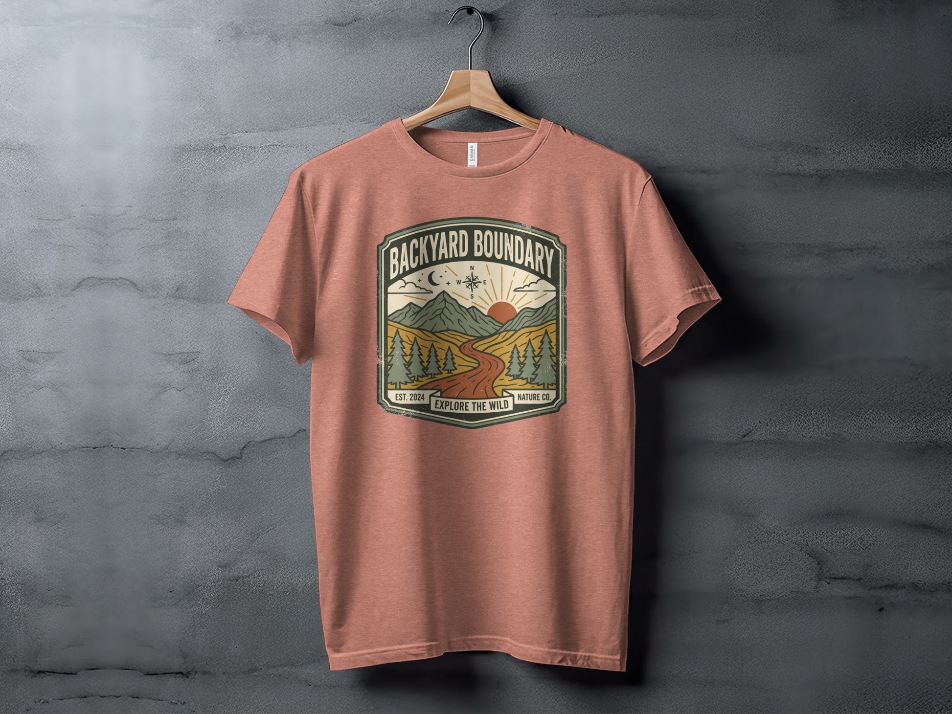 Rugged Backyard Boundary: Explore The Wild Wilderness Shirt: Backyard Boundary Nature Co. t-shirt with mountains, sun, and trees graphic.
