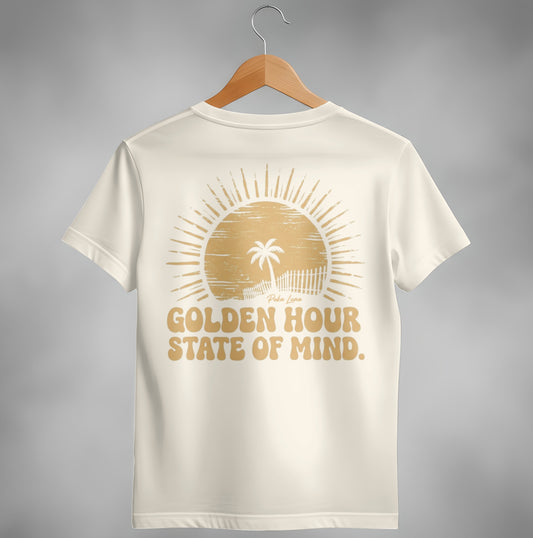 Cream t-shirt with golden sun and palm tree graphic and "Golden Hour State of Mind" text.