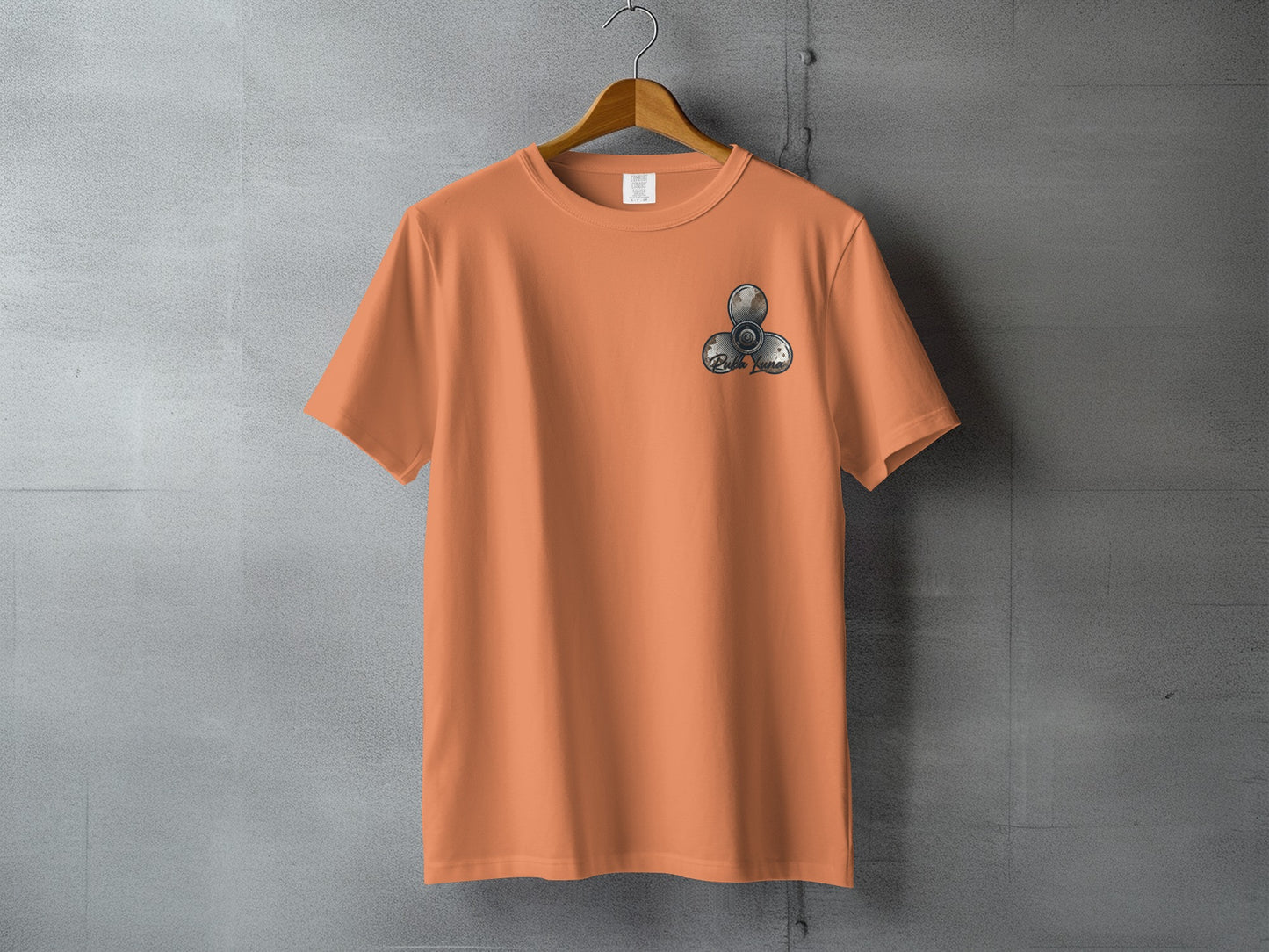 Orange t-shirt with a three-bladed fidget spinner graphic on the left chest.
