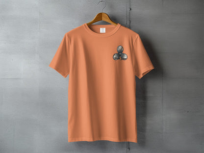Orange t-shirt with a three-bladed fidget spinner graphic on the left chest.