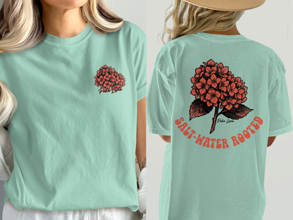 Mint green t-shirt with coral hydrangea graphic and text.