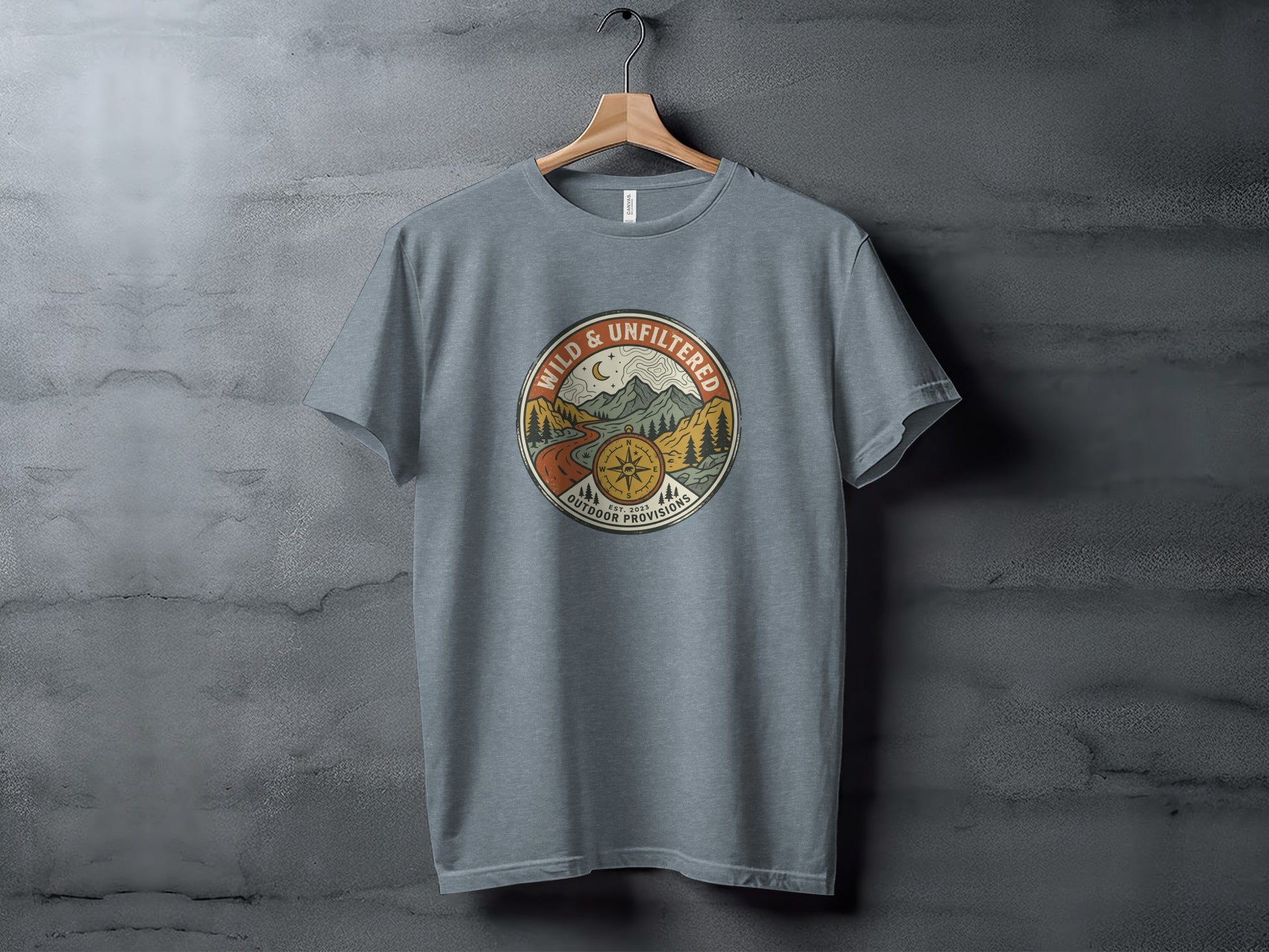 Rugged Wild & Unfiltered Explorer Wilderness Shirt: Grey t-shirt with "Wild & Unfiltered Outdoor Provisions" circular logo.
