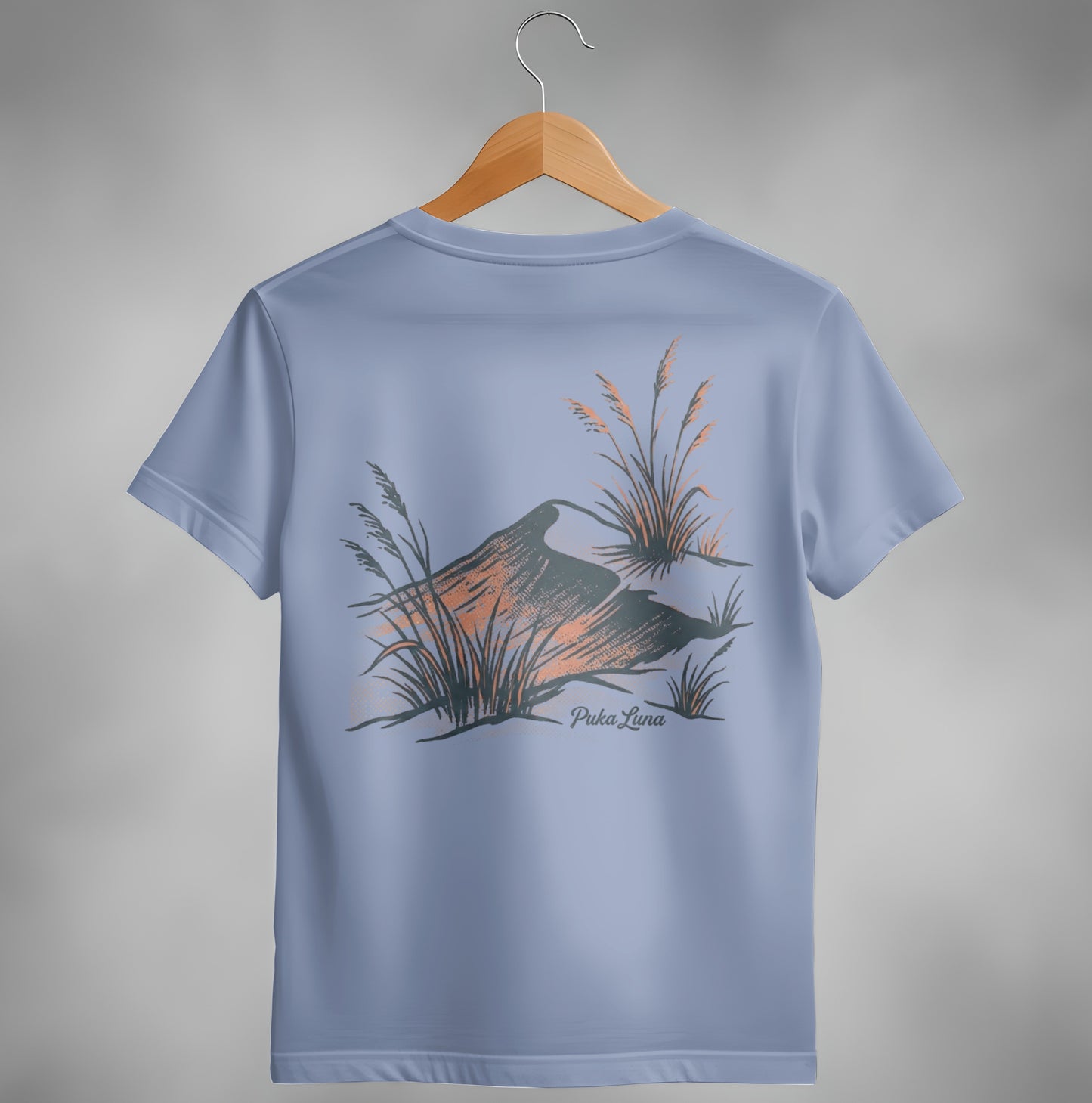 Periwinkle t-shirt with abstract landscape and Puka Luna logo.