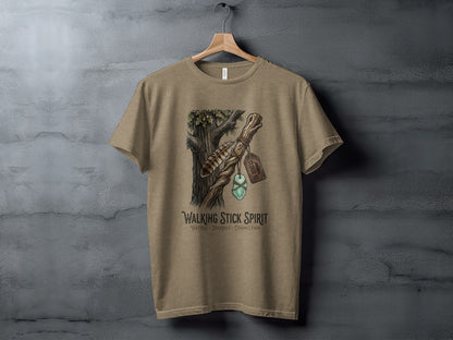 Heritage Walking Stick Spirit: Journey Nomad Tee: T-shirt graphic with walking stick, feathers, and green stones.