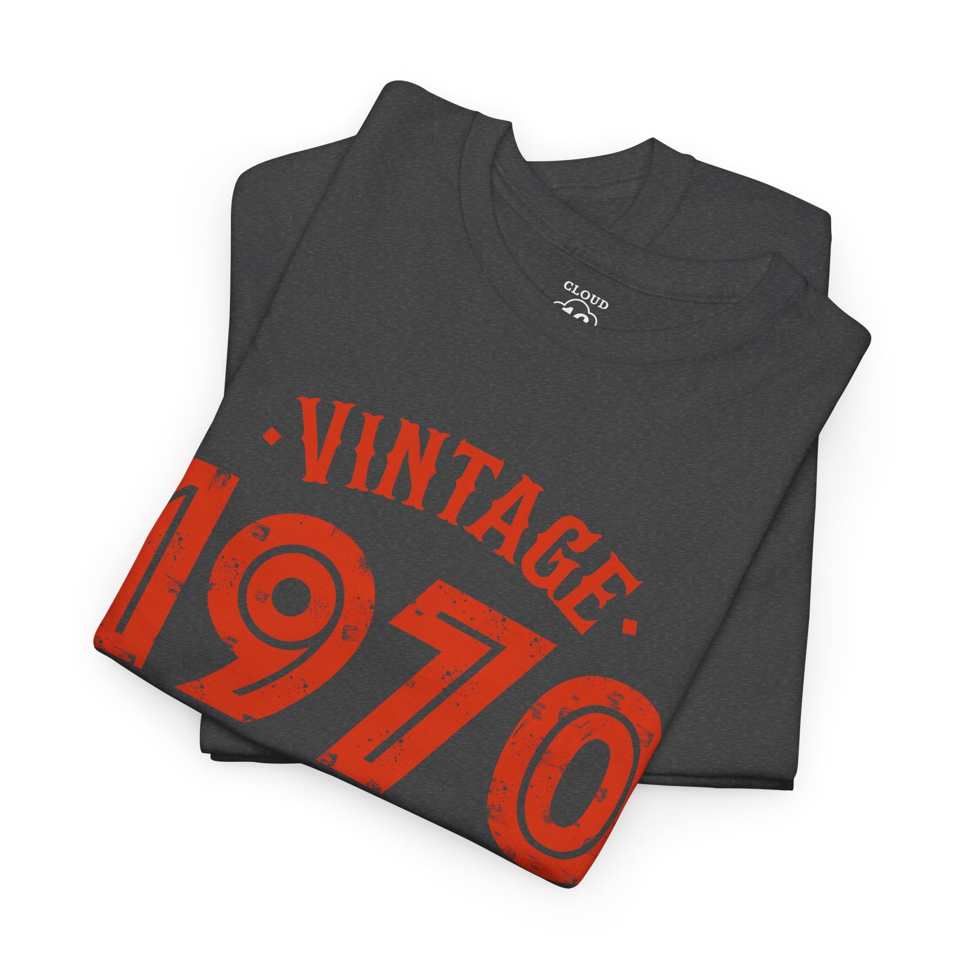 Folded black t-shirt with red 'Vintage 1970' text on a white background