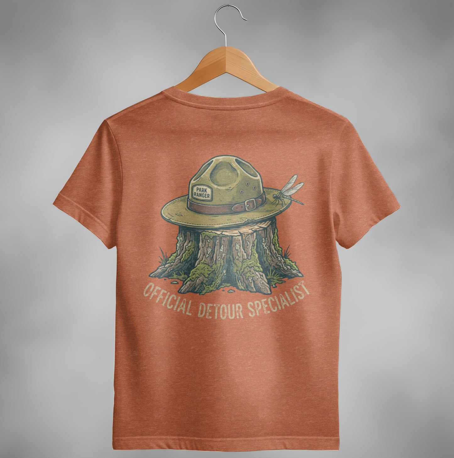Orange t-shirt with park ranger hat, stump, and dragonfly graphic.