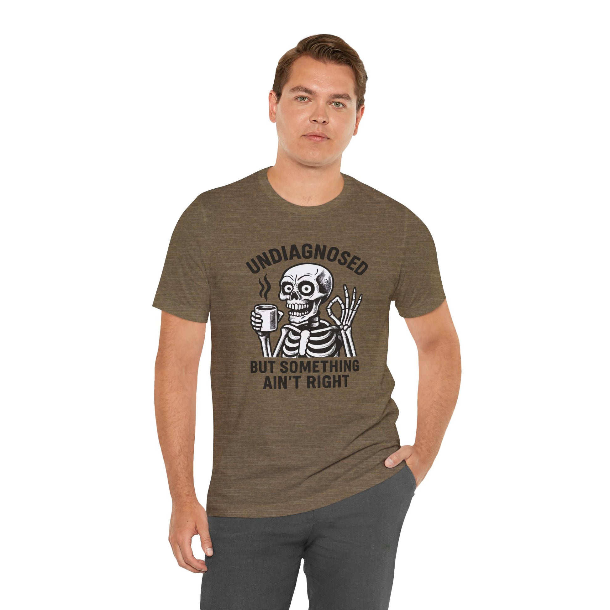 Man wearing a brown t-shirt with a skeleton graphic and text on a white background
