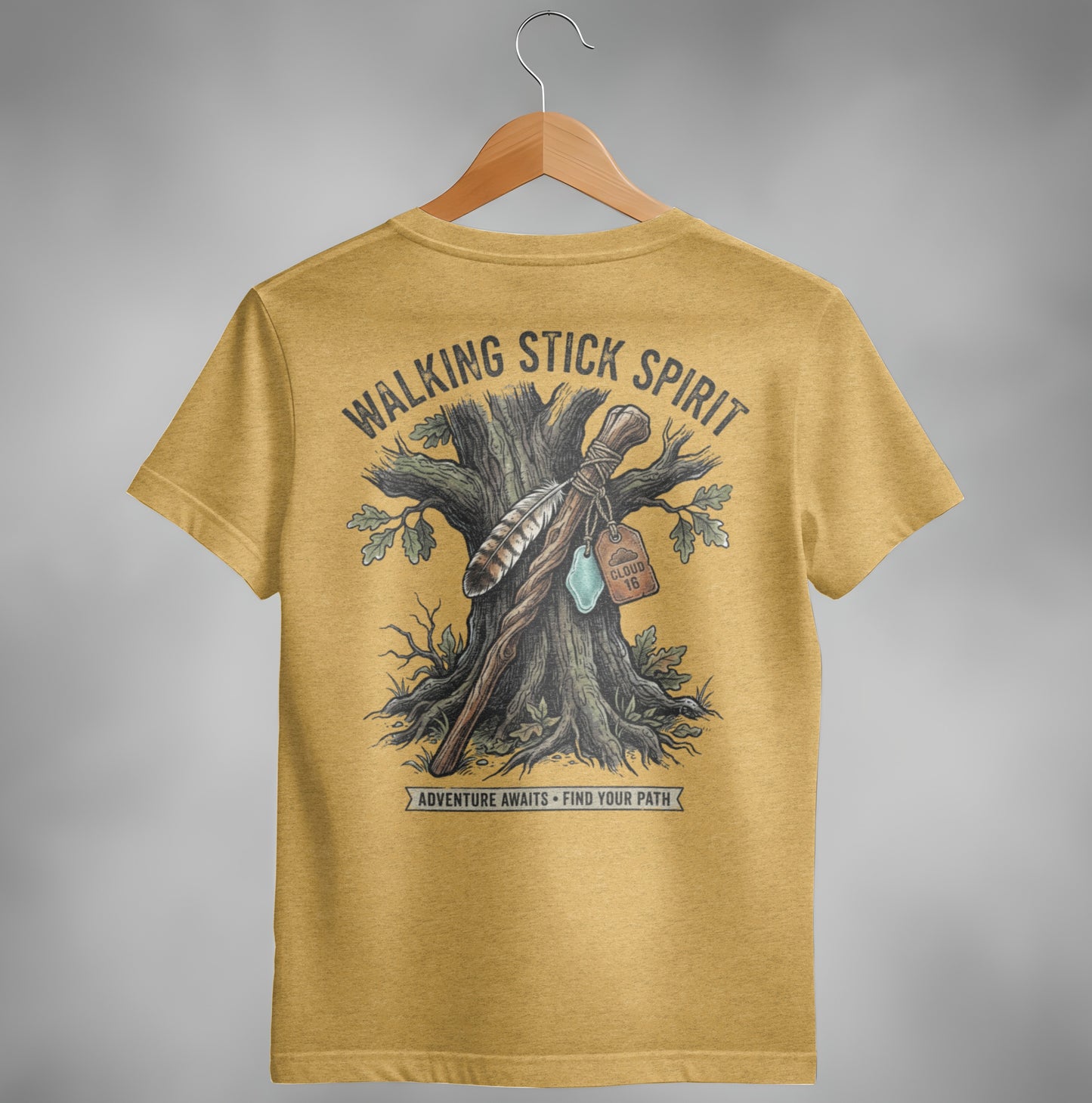 Yellow t-shirt with "Walking Stick Spirit" text and tree with feather and tag graphic.