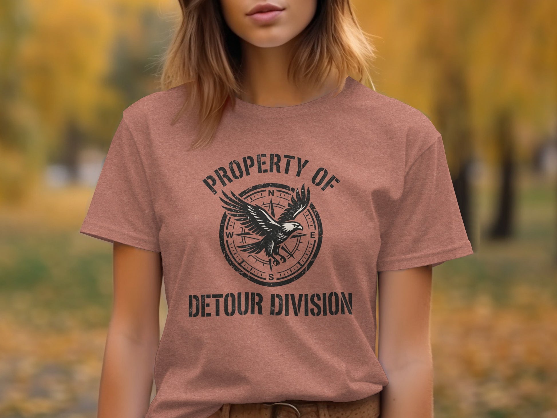 Rugged Detour Division Compass Eagle Tee Wilderness Shirt: Brown t-shirt with a compass and eagle graphic; text reads "Property of Detour Division."