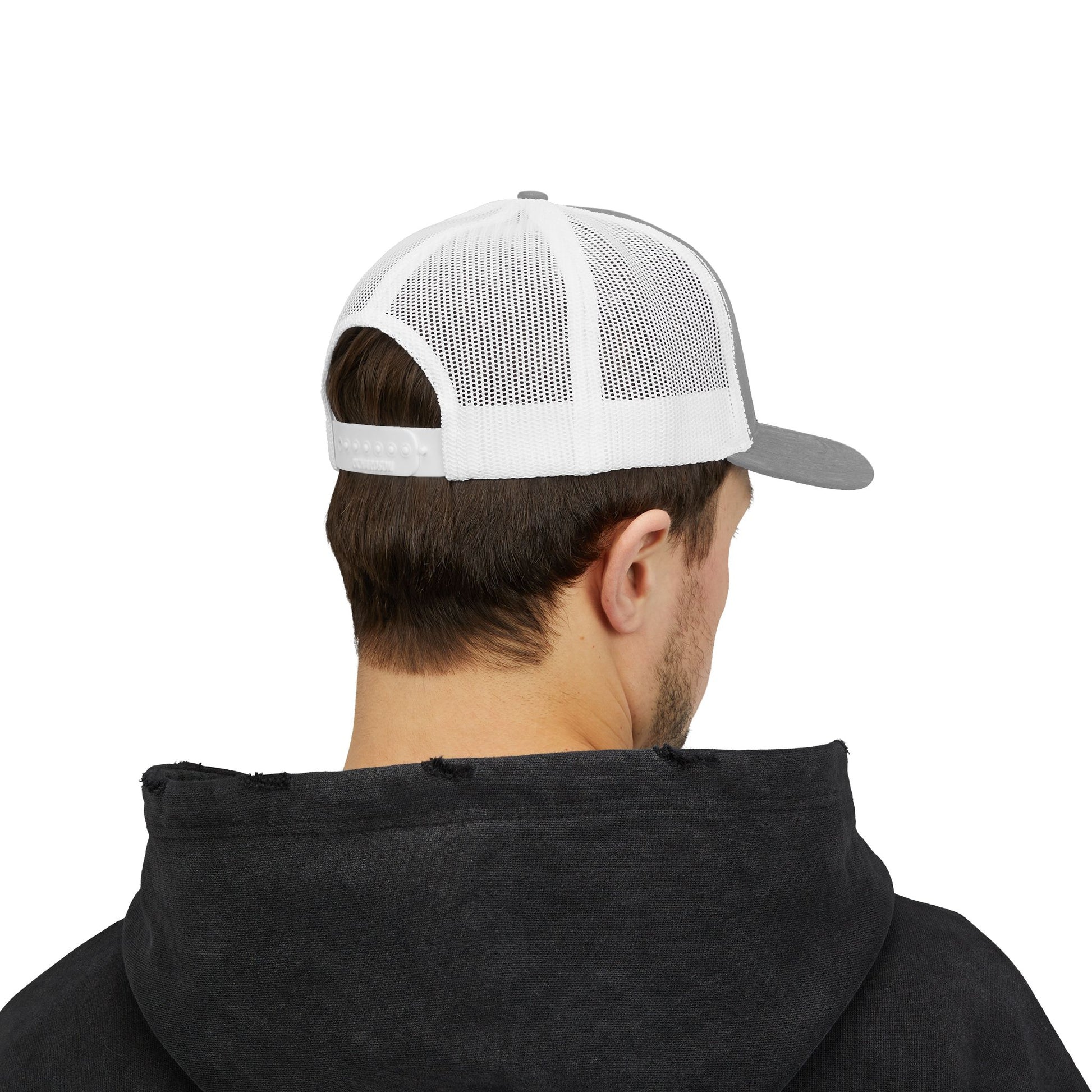 Person wearing a black hoodie and a white and gray cap on a white background