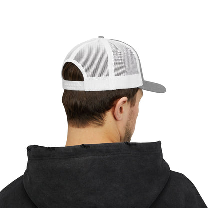 Person wearing a black hoodie and a white and gray cap on a white background