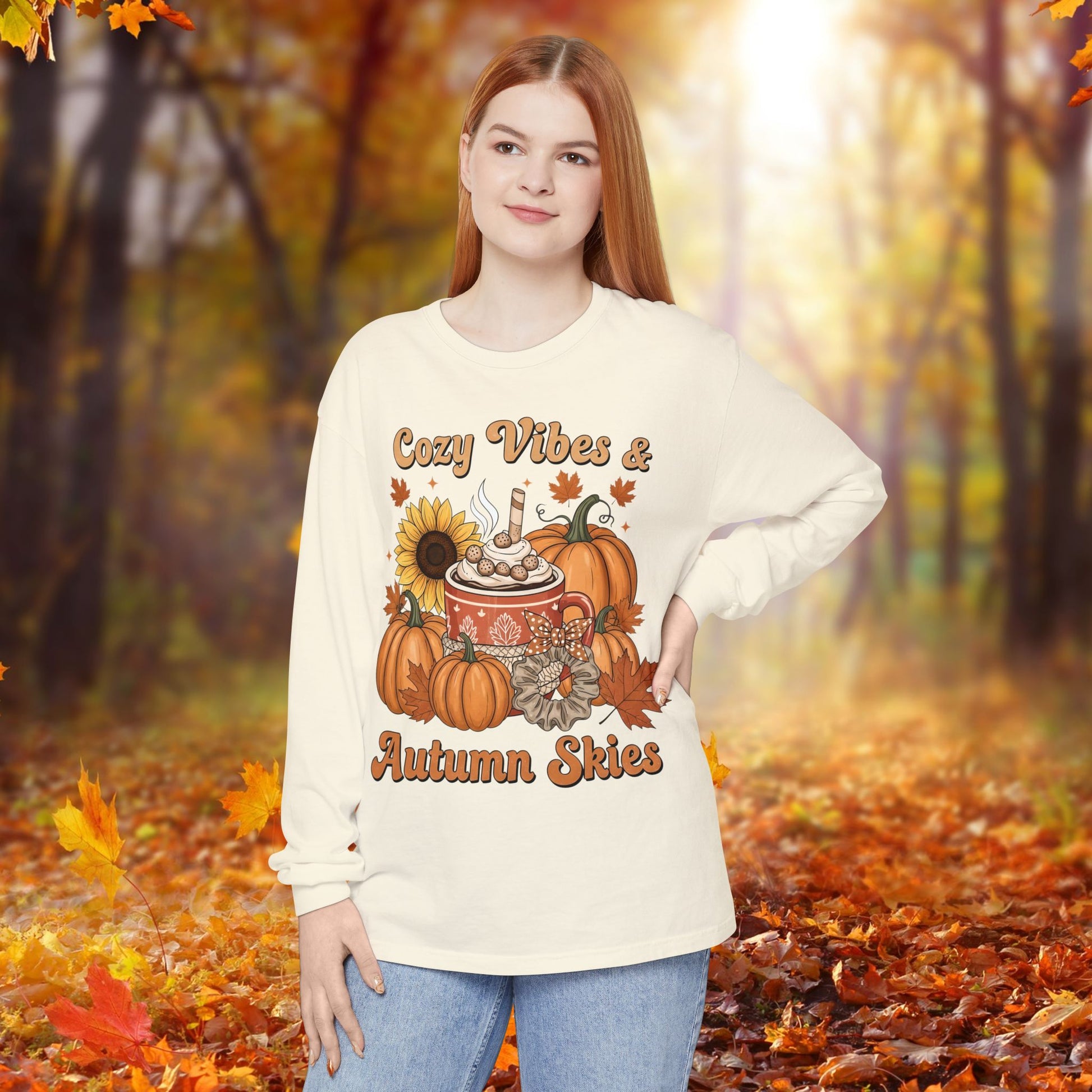 Person wearing a sweater with autumn-themed design in an autumn forest setting