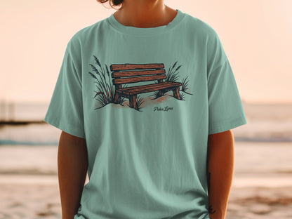 T-shirt with illustration of wooden park bench and dune grass.