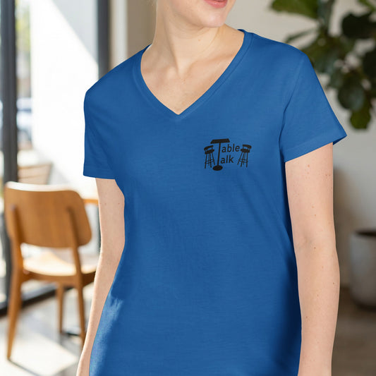 Blue v-neck t-shirt with "Table Talk" logo and two stools.