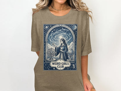 Woman in t-shirt with celestial design and "Weird Girls Club" text.