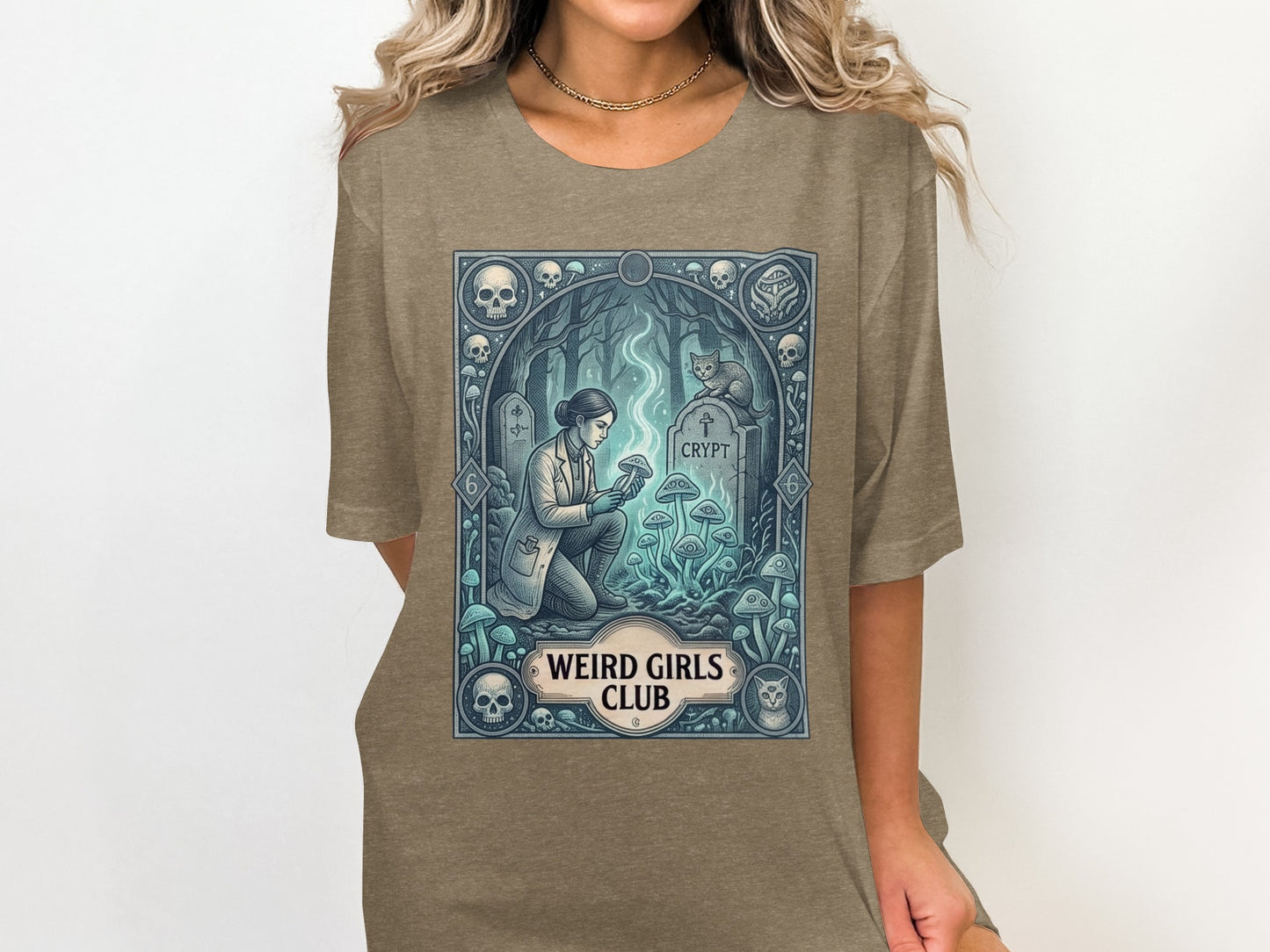 T-shirt graphic with woman examining glowing mushrooms near a crypt.