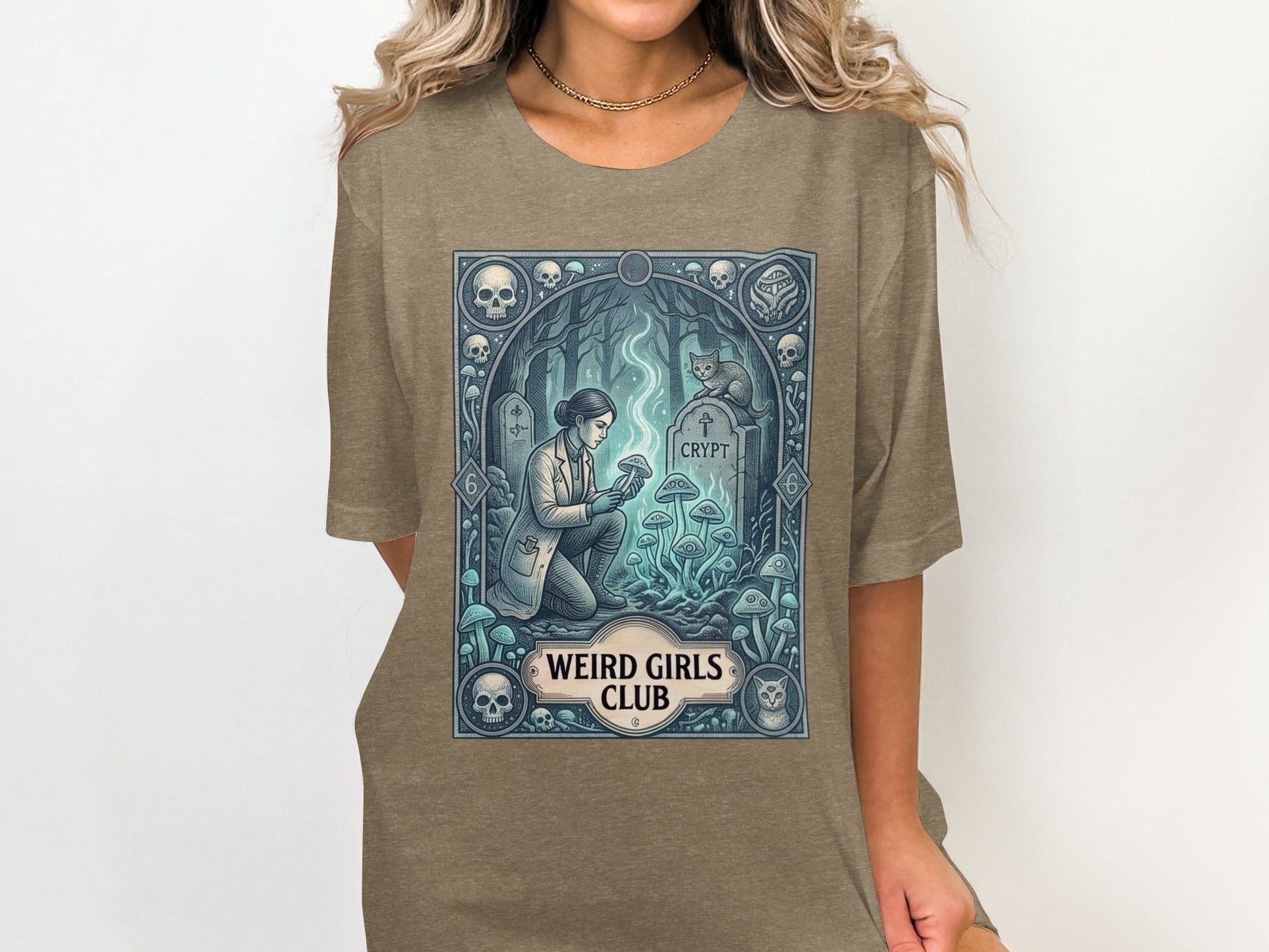 T-shirt graphic with woman examining glowing mushrooms near a crypt.