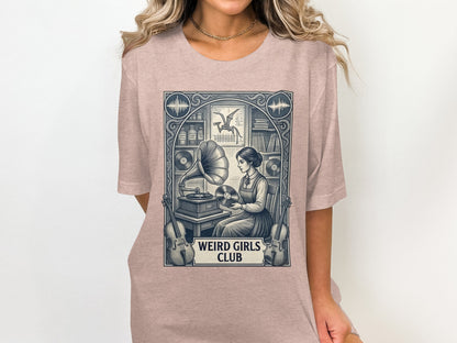 T-shirt graphic featuring a vintage scene with a woman and gramophone, text "Weird Girls Club".