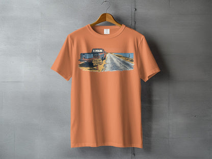 Orange t-shirt with graphic of a vintage truck and "Fresh Crab" sign.
