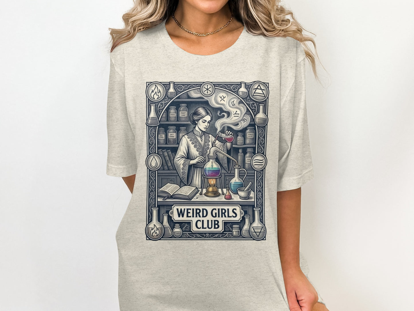 "WEIRD GIRLS CLUB" text on a t-shirt featuring a woman in a lab coat in a chemistry lab.