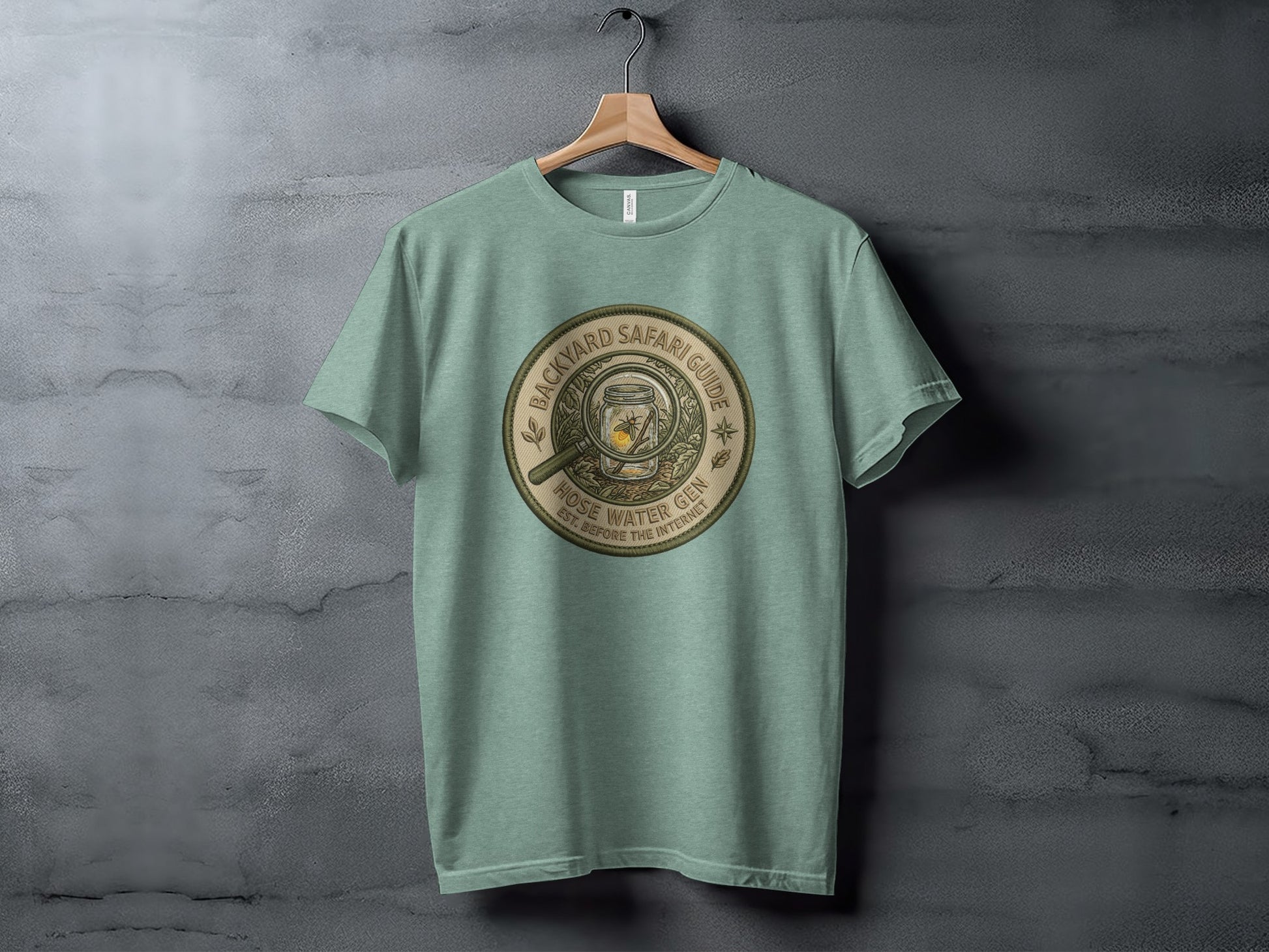 Backyard Safari Guide Explorer: Backcountry Outpost Shirt: T-shirt with round "Backyard Safari Guide" logo featuring a jar of fireflies.