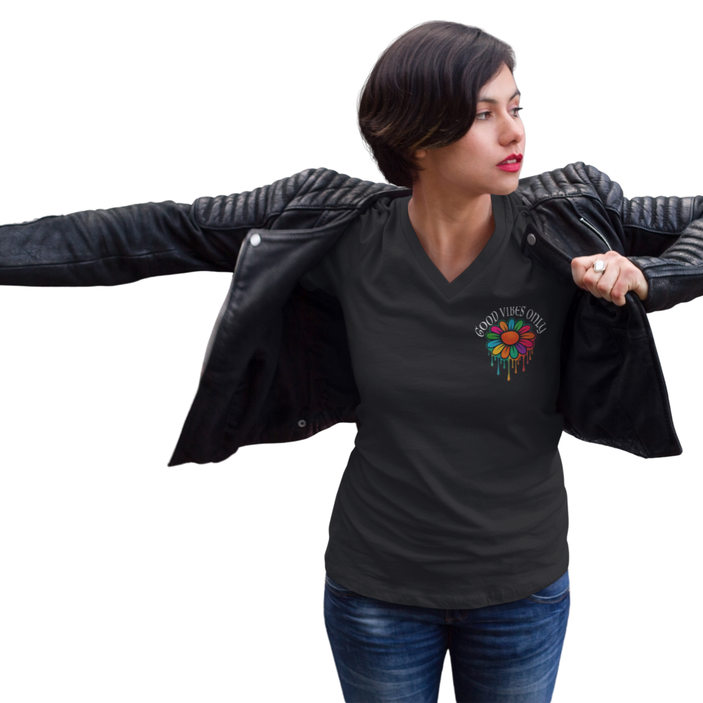 Woman wearing a black V-neck t-shirt with a colorful graphic design, holding a black leather jacket.
