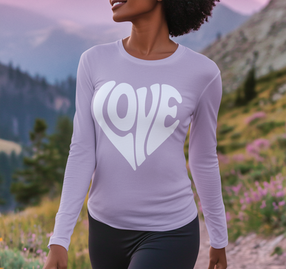 Person wearing a purple long-sleeve shirt with 'LOVE' printed on it against a mountainous landscape.