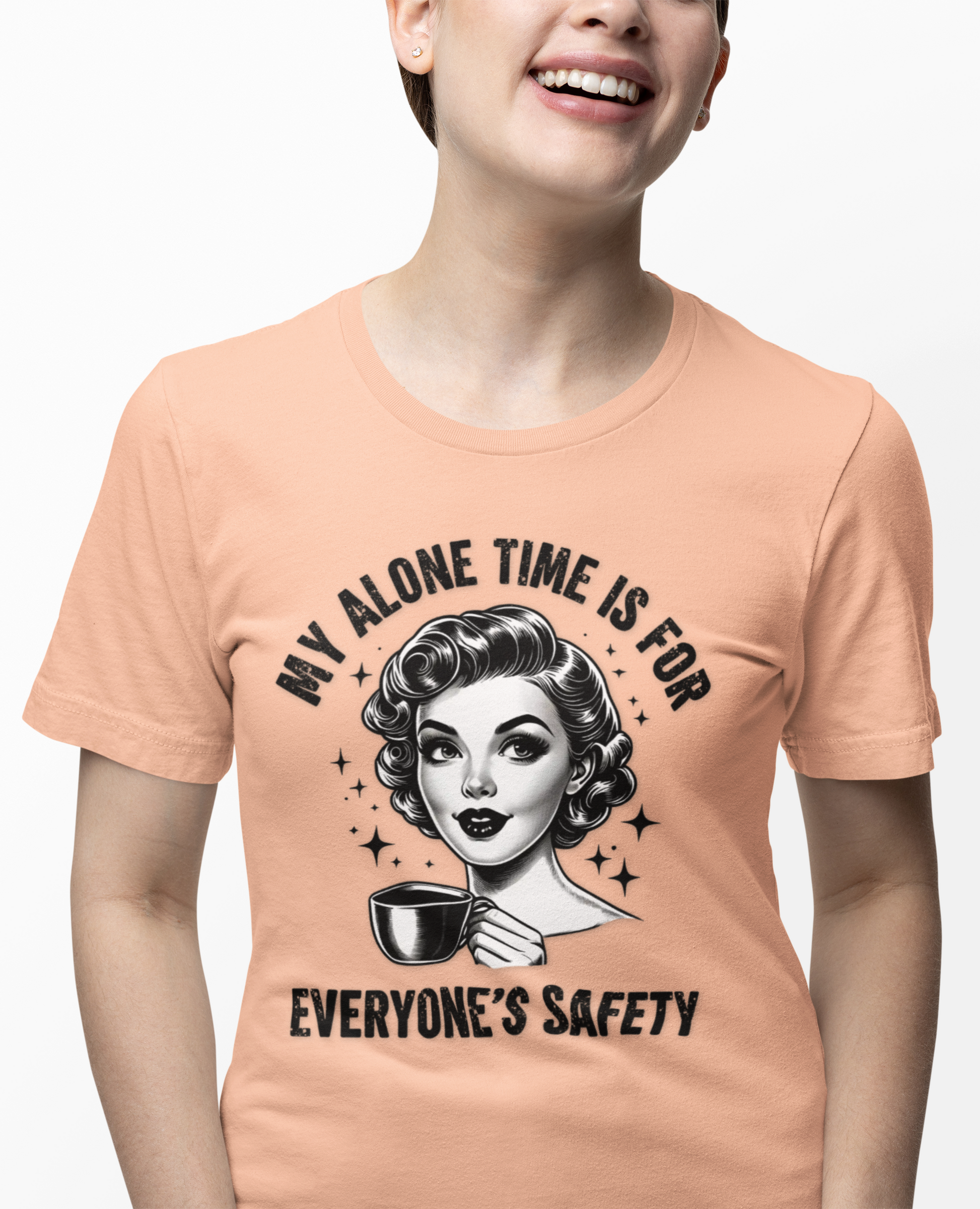 Person wearing a peach t-shirt with a graphic design and text.