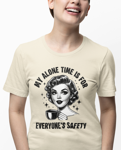 Person wearing a beige t-shirt with a graphic design and text.