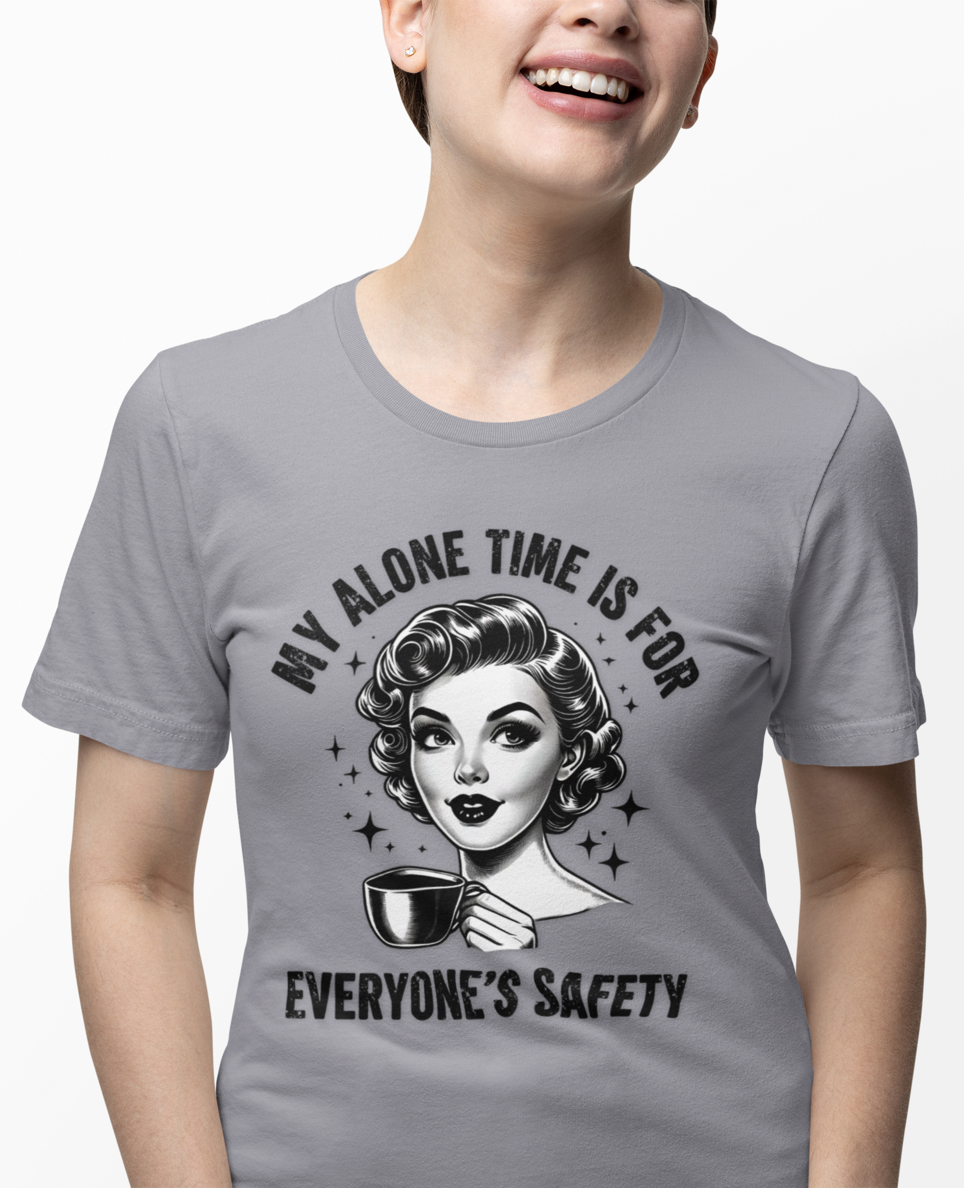 Person wearing a gray t-shirt with a graphic design and text.