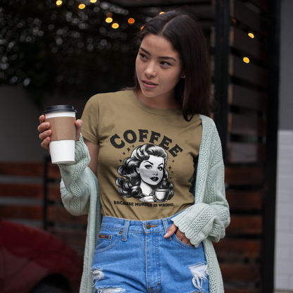 Woman wearing a 'Coffee' graphic t-shirt holding a coffee cup outdoors.