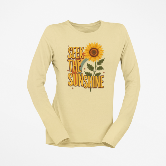 Beige long-sleeve shirt with sunflower graphic and 'Seek the Sunshine' text on a white background
