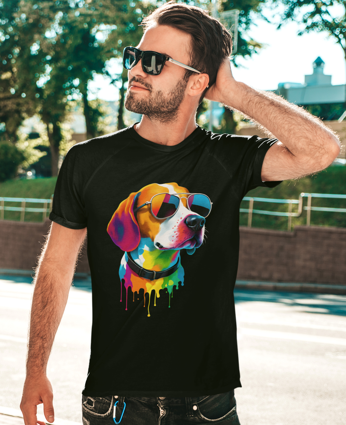 Man wearing a black t-shirt with a colorful dog graphic outdoors.