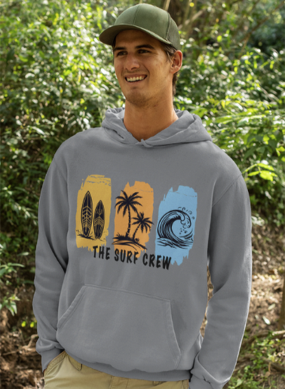 Person wearing a gray hoodie with 'The Surf Crew' design outdoors.