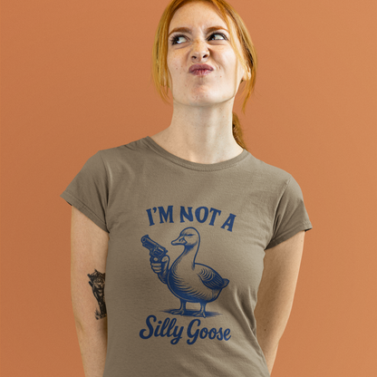 Woman wearing a brown t-shirt with a graphic and text against an orange background