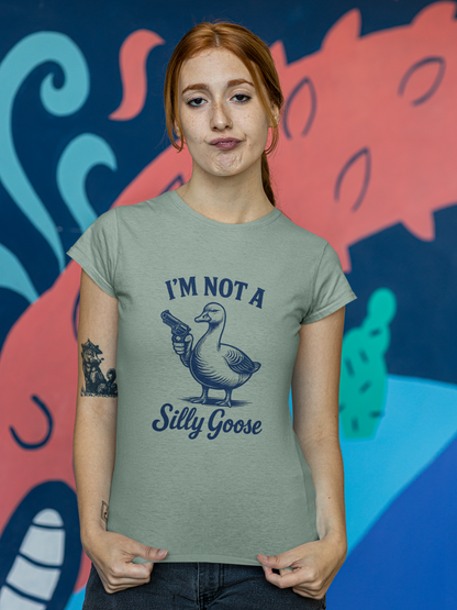 Person wearing a t-shirt with a graphic and text in front of a colorful mural.