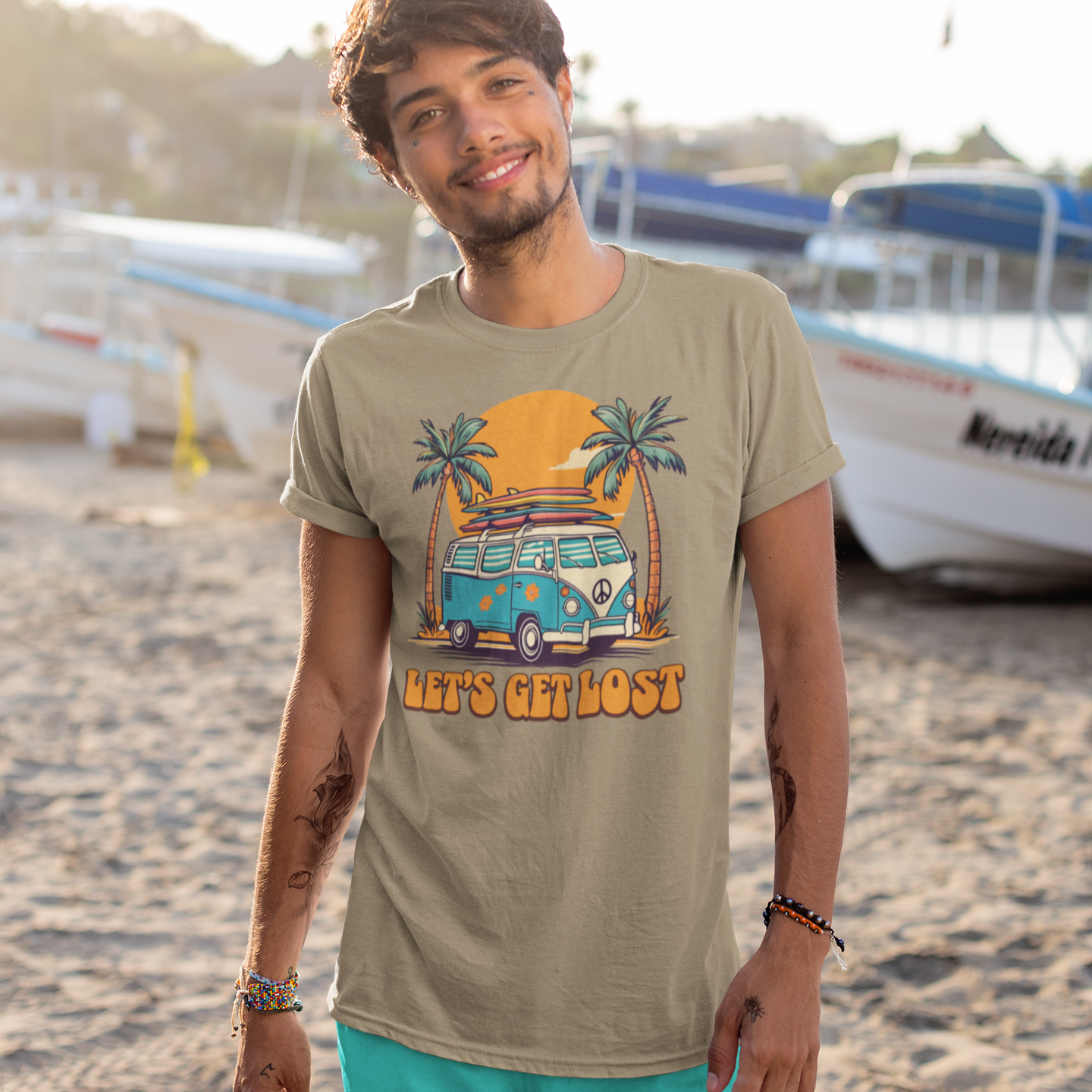 Man wearing a t-shirt with a graphic design on a beach