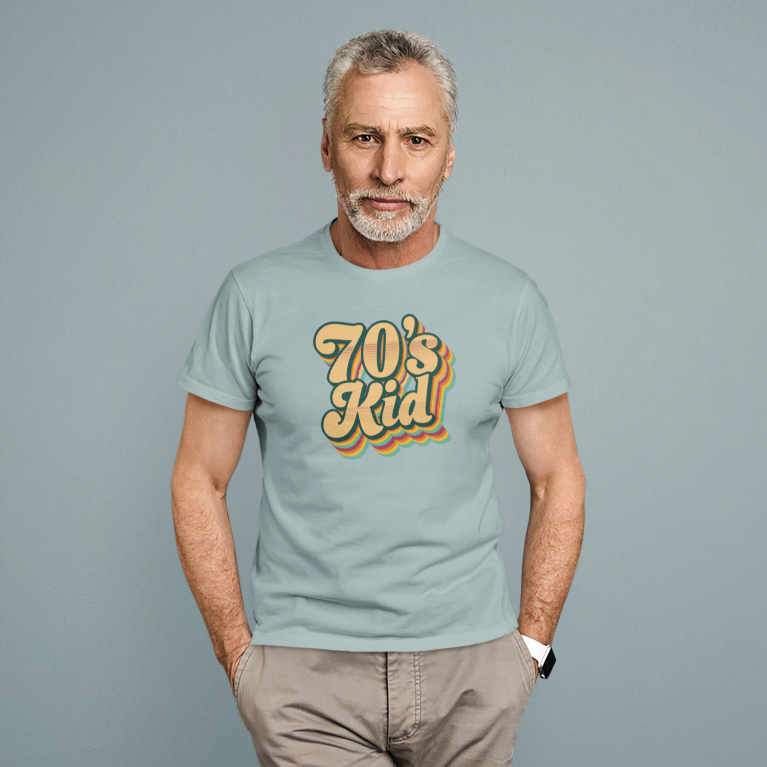 Man wearing a t-shirt with '70's Kid' text on a gray background