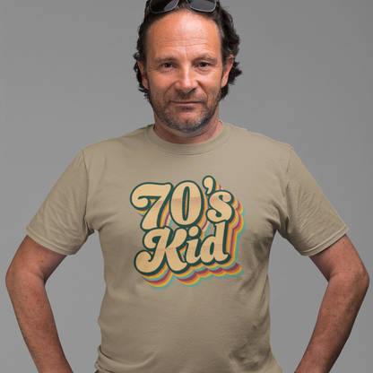 Man wearing a beige t-shirt with '70's Kid' design on a gray background