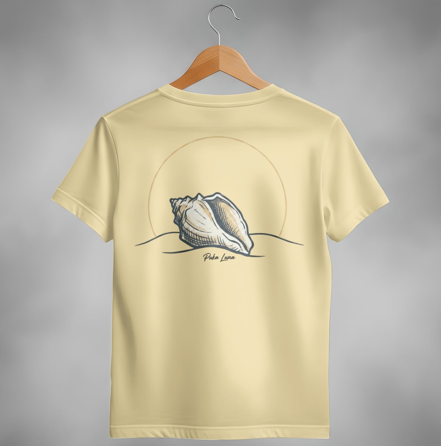 Shell graphic on a tan t-shirt with a circular sun behind it.