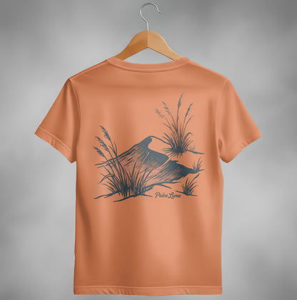 Orange t-shirt with dark grey illustration of dune grass and "Puka Luna" text.